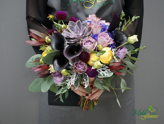Bridal bouquet with black calla lilies, yellow peony-style roses, blue hydrangea, purple roses, and succulents photo